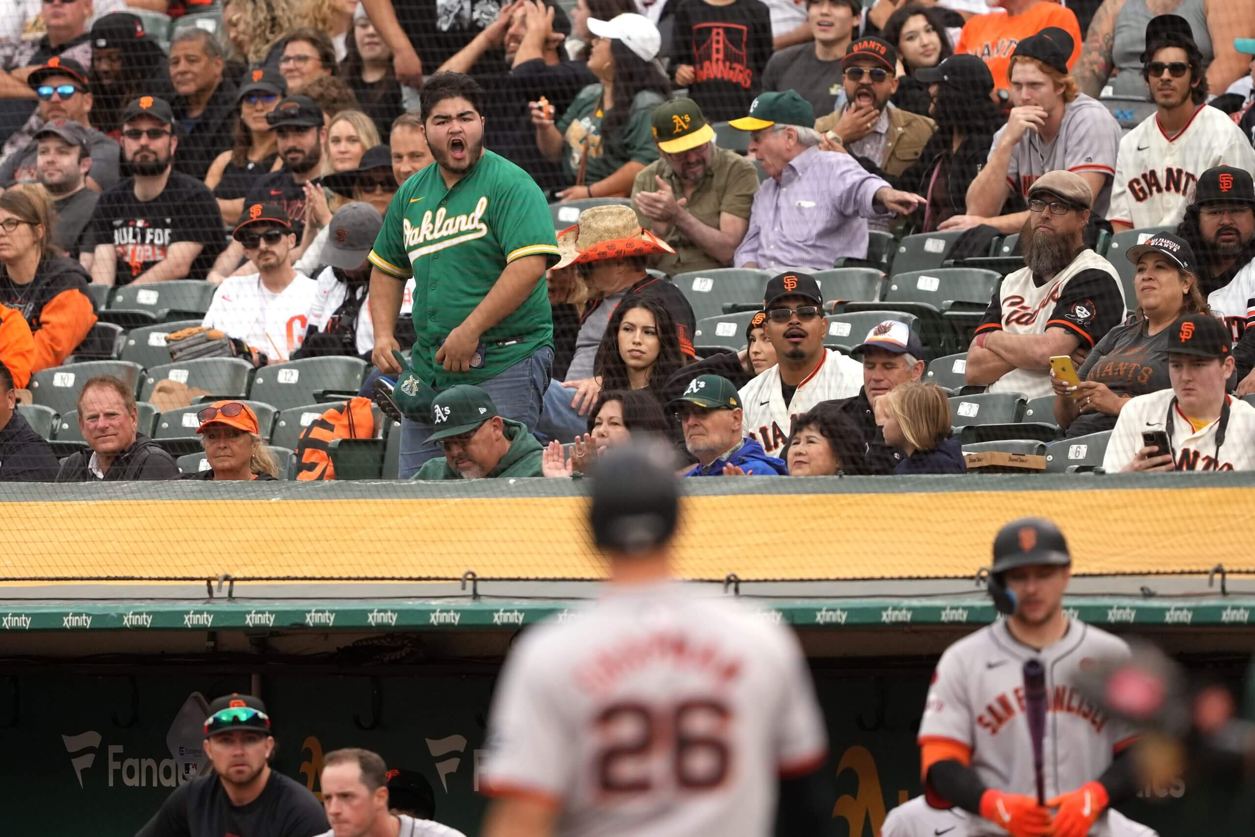 Fans react as Matt Chapman walks back to the dugout during a game against the Athletics at the Coliseum.