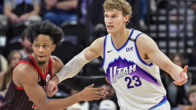 Nov 16, 2025; Salt Lake City, Utah, USA; Chicago Bulls forward/guard Isaac Okoro (35) looks to defend Utah Jazz forward/center Lauri Markkanen (23) during double overtime at Delta Center.