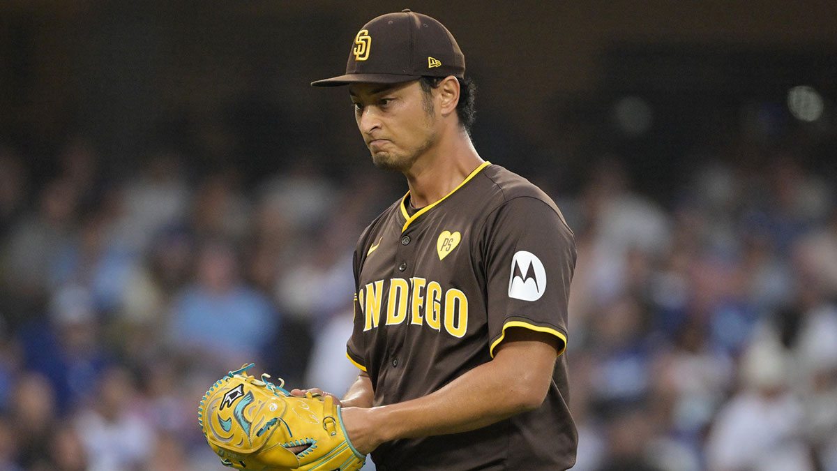 Oct 11, 2024; Los Angeles, California, USA; San Diego Padres pitcher Yu Darvish (11) reacts in the fourth inning against the Los Angeles Dodgers during game five of the NLDS for the 2024 MLB Playoffs at Dodger Stadium. Mandatory Credit: Jayne Kamin-Oncea-Imagn Images