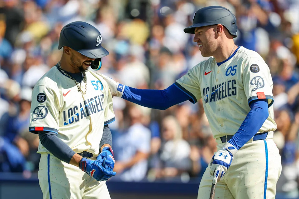 Los Angeles Dodgers All-Stars Freddie Freeman and Mookie Betts after a home run.