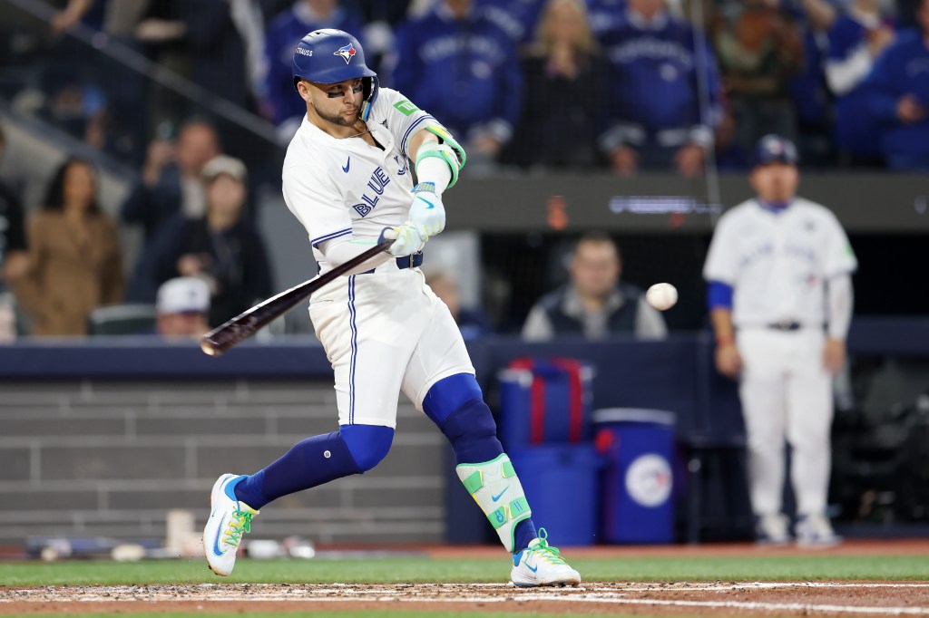 Bo Bichette of the Toronto Blue Jays hitting a three-run home run.