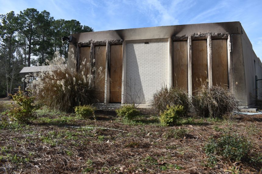 Boards cover the charred remains of the Beth Israel Congregation library, which was set on fire early Saturday morning, on Monday, in Jackson, Mississippi.