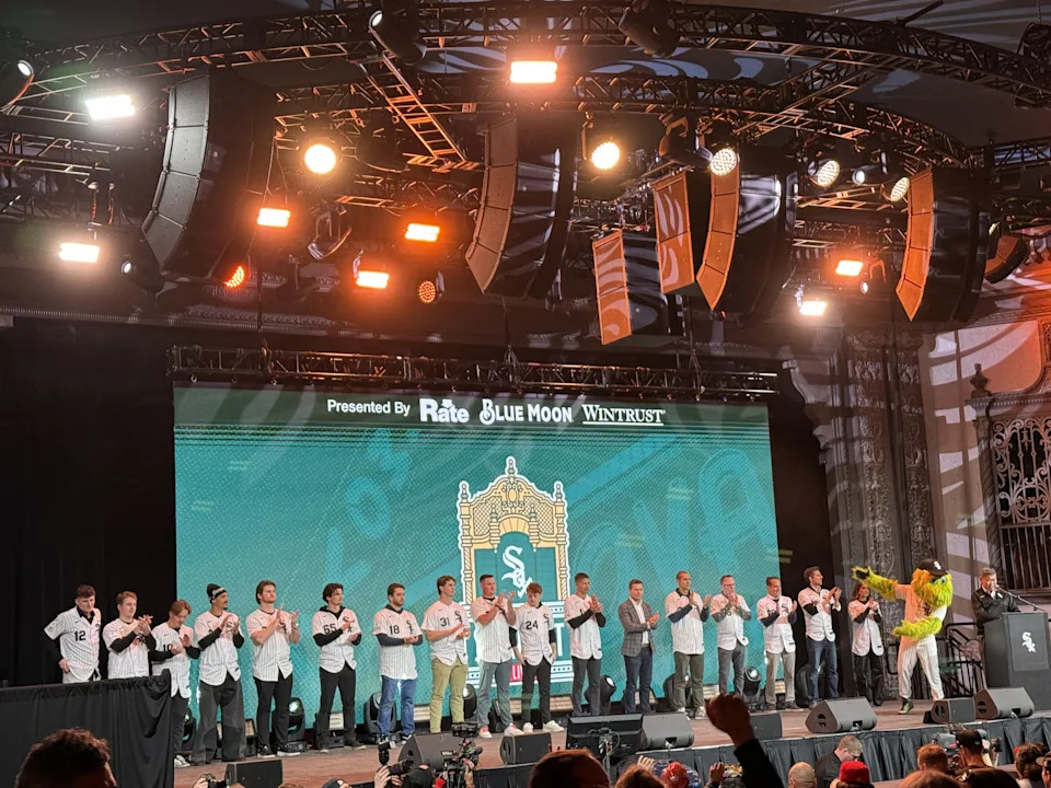 White Sox players and staff on the stage from left to right: Colson Montgomery, Kyle Teel, Chase Meidroth, Miguel Vargas, Shane Smith, Davis Martin, Anthony Kay, Grant Taylor, Tanner McDougal, Sam Antonacci, followed by Will Venable, Chris Getz, John Schriffen, Len Kasper, Chuck Garfein, Connor McKnight, and Brooke Fletcher