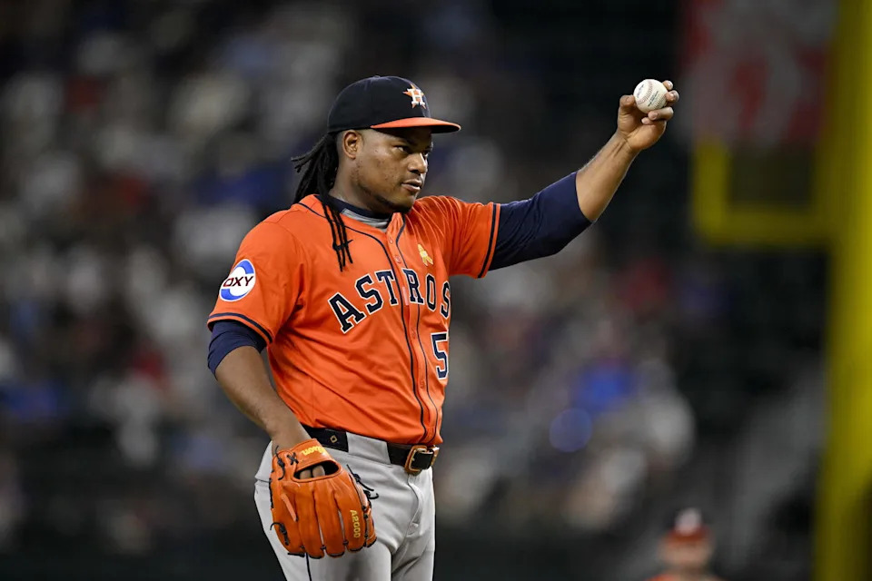 Sep 7, 2025; Arlington, Texas, USA; Houston Astros starting pitcher Framber Valdez (59) motions for a new ball during the sixth inning against the Texas Rangers at Globe Life Field. (Jerome Miron/Imagn Images)