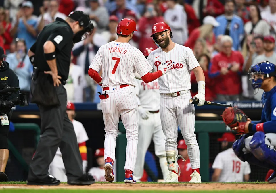 Sep 25, 2024; Philadelphia, Pennsylvania, USA; Philadelphia Phillies shortstop Trea Turner (7) reacts with first baseman Bryce Harper (3) after hitting a home run against the Chicago Cubs in the first inning at Citizens Bank Park. Mandatory Credit: Kyle Ross-Imagn Images