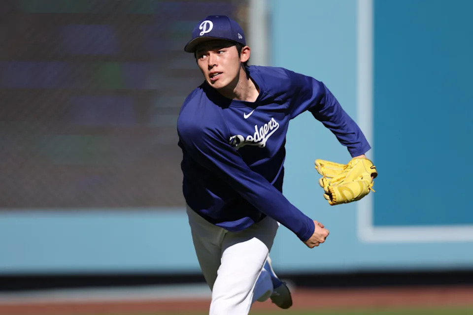 Oct 29, 2025; Los Angeles, California, USA; Los Angeles Dodgers pitcher Roki Sasaki (11) warms up before game five of the 2025 MLB World Series against the Toronto Blue Jays at Dodger Stadium. Mandatory Credit: Kiyoshi Mio-Imagn Images