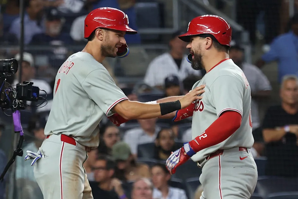 Jul 25, 2025; Bronx, New York, USA; Philadelphia Phillies designated hitter Kyle Schwarber (12) scores after hitting a two run home run during the fifth inning against the New York Yankees at Yankee Stadium. Mandatory Credit: Vincent Carchietta-Imagn Images