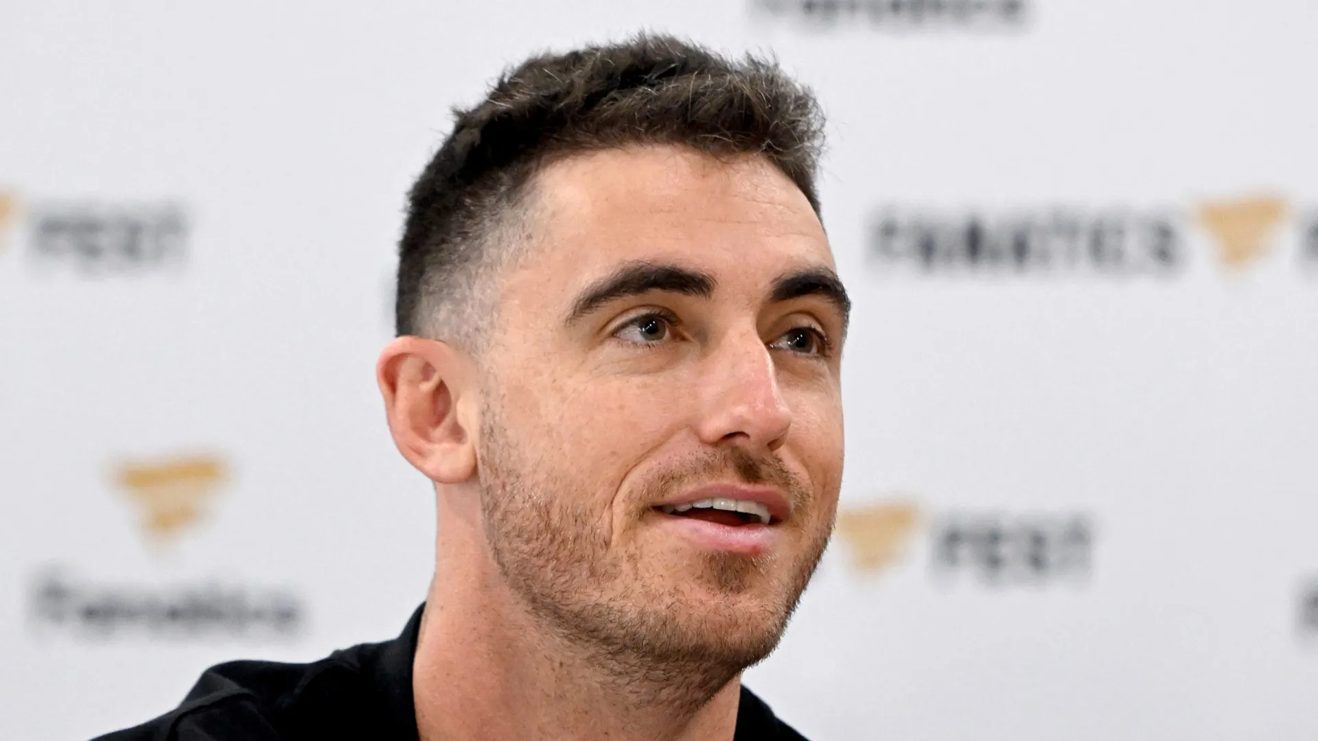 Cody Bellinger smiles during an event with fans.