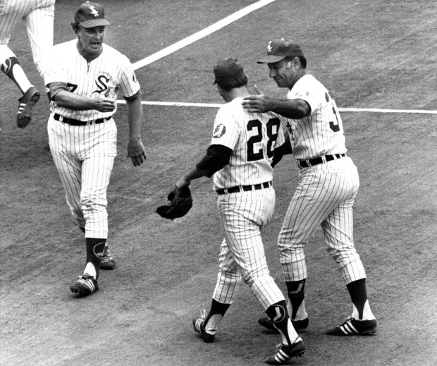White Sox pitcher Wilbur Wood is congratulated by manager Chuck Tanner after beating the Yankees for his 22nd victory Aug. 23, 1972, at Comiskey Park. (Ray Gora/Chicago Tribune) 