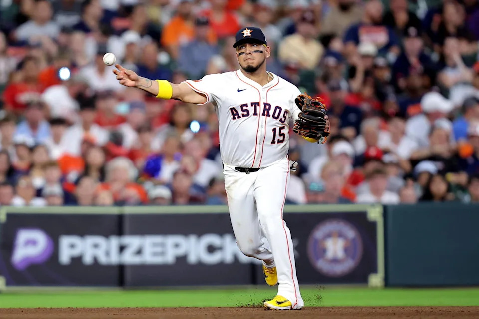 Jun 26, 2025; Houston, Texas, USA; Houston Astros third baseman Isaac Paredes (15) throws a fielded ball to first base for an out against the Philadelphia Phillies during the seventh inning at Daikin Park. (Erik Williams/Imagn Images)