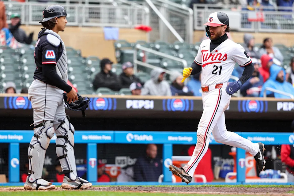 May 21, 2025; Minneapolis, Minnesota, USA; Minnesota Twins left fielder DaShawn Keirsey Jr. (21) scores on a single hit by center fielder Harrison Bader (12) in the eighth inning during game one of a doubleheader against the Cleveland Guardians at Target Field. Mandatory Credit: Matt Krohn-Imagn Images