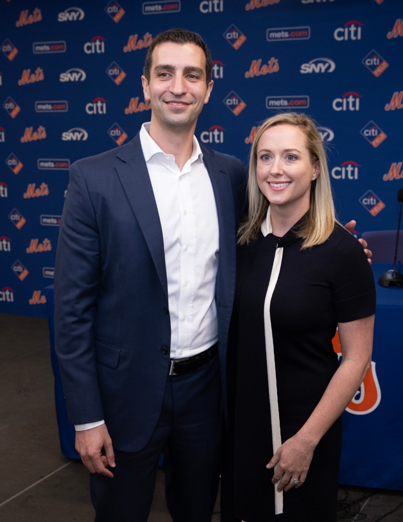 David Stearns, the new President of Baseball Operations for the New York Mets, poses with his wife, Whitney, at a press conference.
