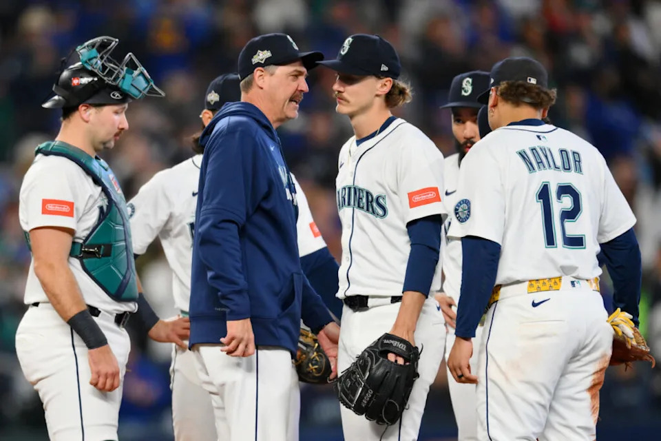 Oct 17, 2025; Seattle, Washington, USA; Seattle Mariners manager Dan Wilson (6) takes pitcher Bryce Miller (50) out of the game against the Toronto Blue Jays during the fifth inning during game five of the ALCS round for the 2025 MLB playoffs at T-Mobile Park. Mandatory Credit: Steven Bisig-Imagn Images
