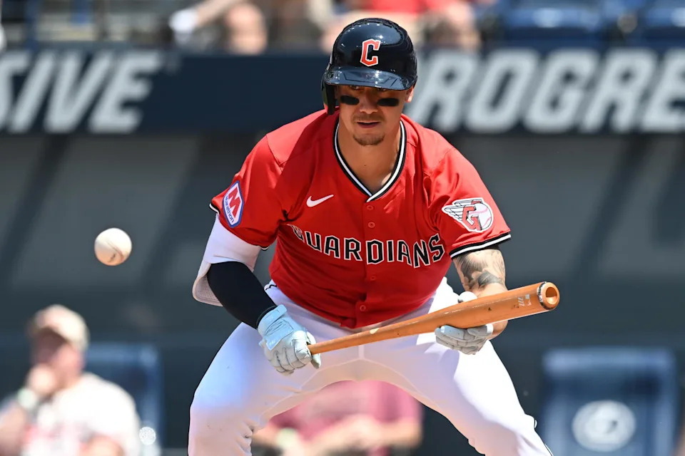 Jun 11, 2025; Cleveland, Ohio, USA; Cleveland Guardians catcher Dom Nunez (46) hits a bunt single during the sixth inning against the Cincinnati Reds at Progressive Field. Mandatory Credit: Ken Blaze-Imagn Images