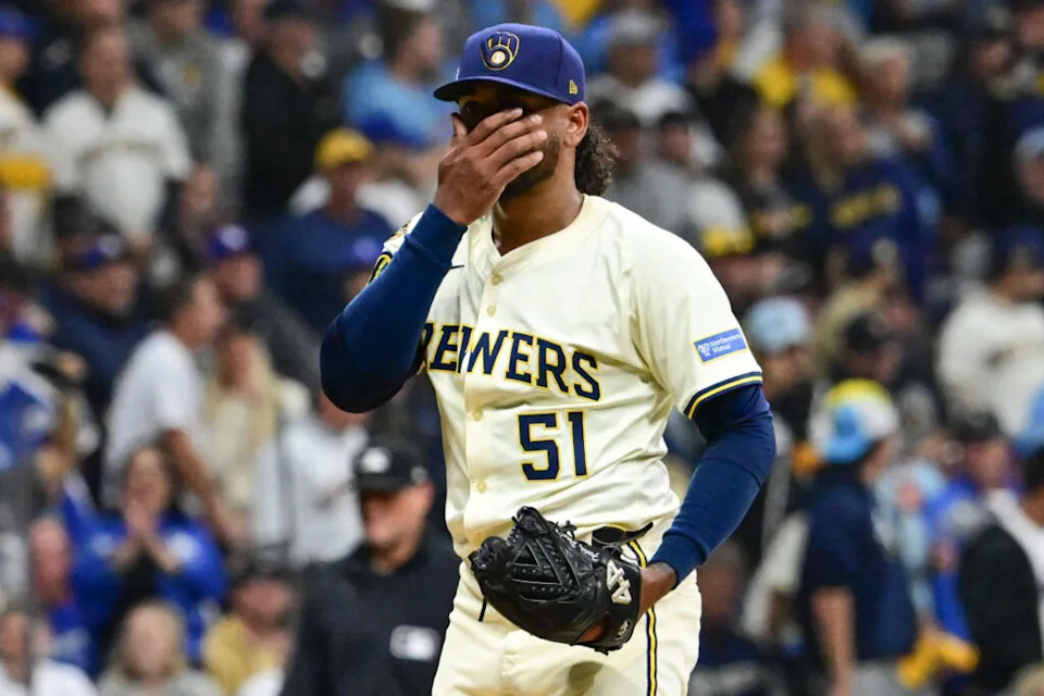 Oct 14, 2025; Milwaukee, Wisconsin, USA; Milwaukee Brewers pitcher Freddy Peralta (51) reacts after giving up a solo home run to Los Angeles Dodgers right fielder Teoscar Hernandez (not pictured) in the second inning during game two of the NLCS round for the 2025 MLB playoffs at American Family Field. Mandatory Credit: Benny Sieu-Imagn Images