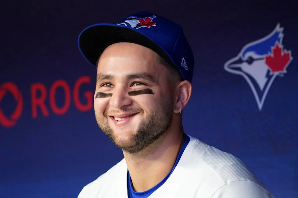 Apr 16, 2025; Toronto, Ontario, CAN; Toronto Blue Jays shortstop Bo Bichette (11) smiles in the dugout before the start of the game against the Atlanta Braves at Rogers Centre. Mandatory Credit: John E. Sokolowski-Imagn Images