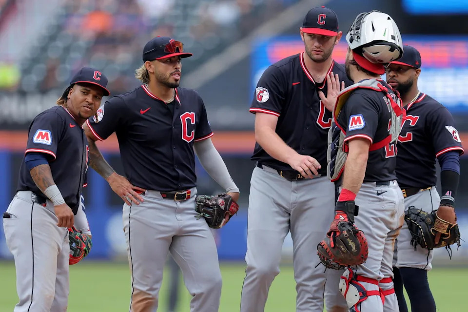 Aug 6, 2025; New York City, New York, USA; Cleveland Guardians starting pitcher Gavin Williams (32) is greeted at the mound by third baseman Jose Ramirez (11) and shortstop Gabriel Arias (13) and catcher Austin Hedges (27) and first baseman Carlos Santana (41) during a pitching change during the ninth inning against the New York Mets at Citi Field. Mandatory Credit: Brad Penner-Imagn Images