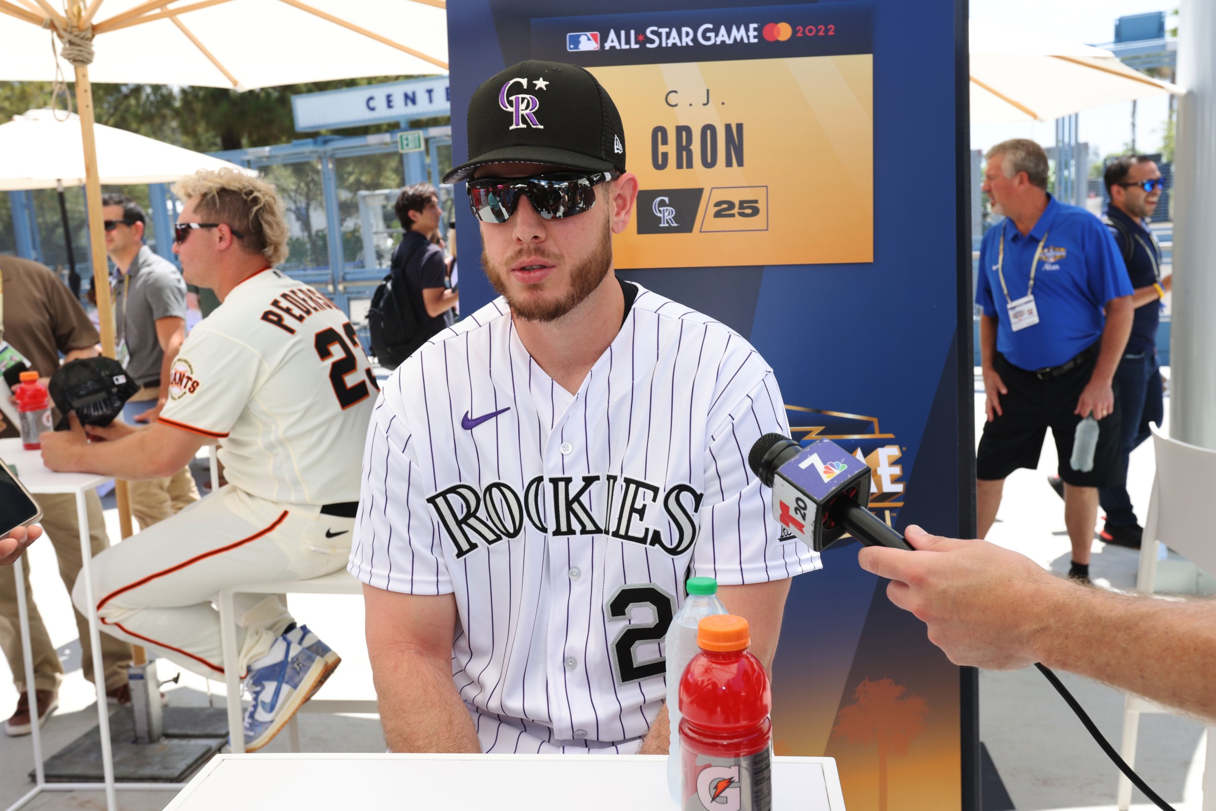 LOS ANGELES, CA - JULY 18: C.J. Cron #25 of the Colorado Rockies looks on while speaking with the media during the National League Media Availability at Dodger Stadium on Monday, July 18, 2022 in Los Angeles, California. (Photo by Rob Tringali/MLB Photos via Getty Images)