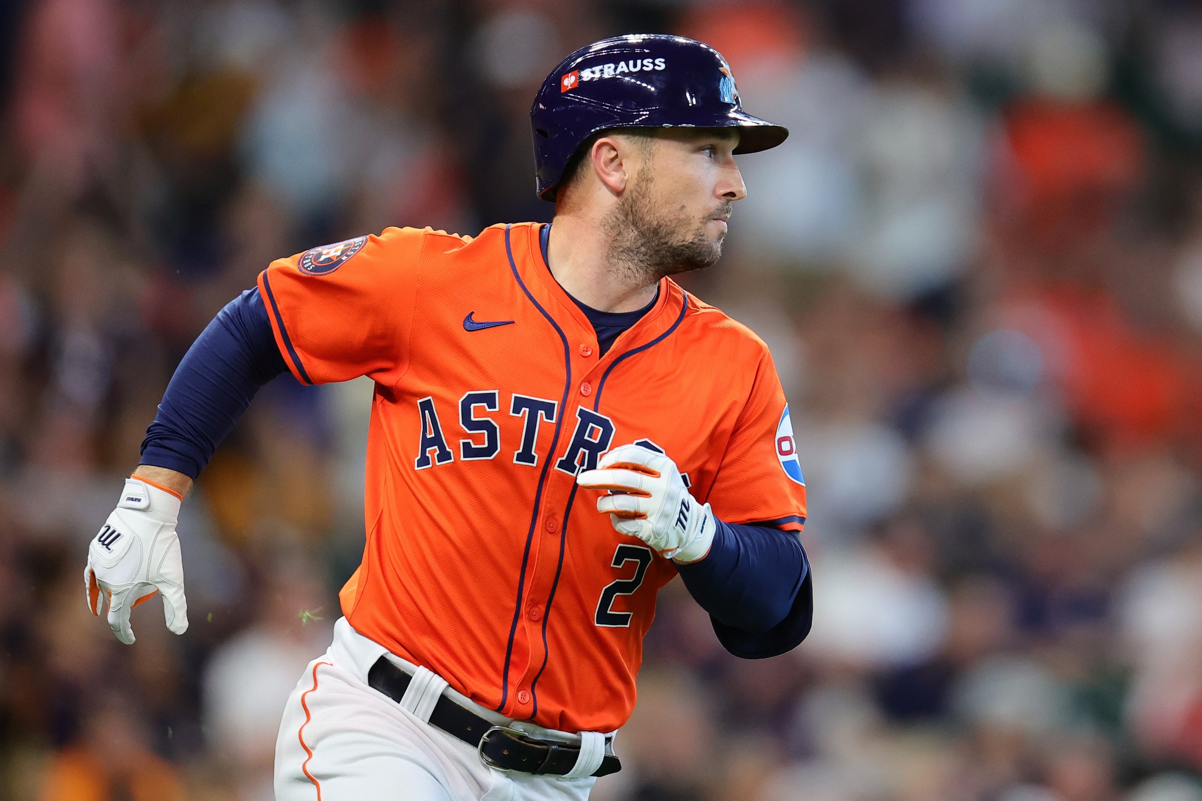 HOUSTON, TEXAS - OCTOBER 02: Alex Bregman #2 of the Houston Astros runs to first base after hitting a single against the Detroit Tigers in the second inning during Game Two of the Wild Card Series at Minute Maid Park on October 02, 2024 in Houston, Texas. (Photo by Alex Slitz/Getty Images)