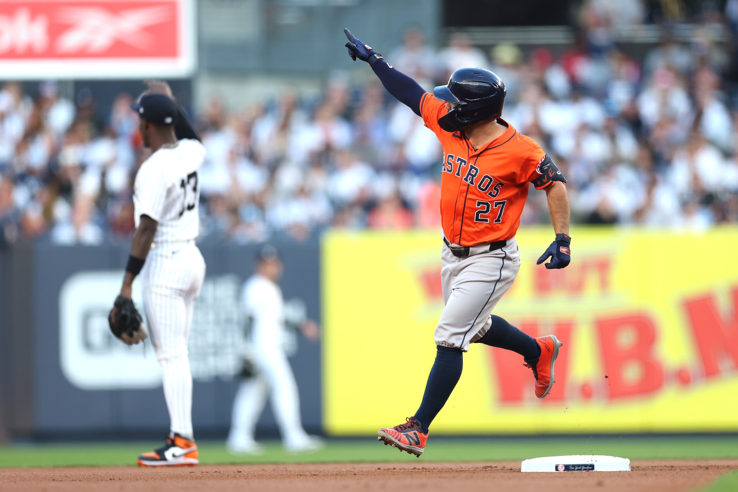 NEW YORK, NEW YORK - AUGUST 08: Jose Altuve #27 of the Houston Astros reacts to hitting a two-run home run during the first inning against the New York Yankees at Yankee Stadium on August 08, 2025 in the Bronx borough of New York City. (Photo by Ishika Samant/Getty Images)