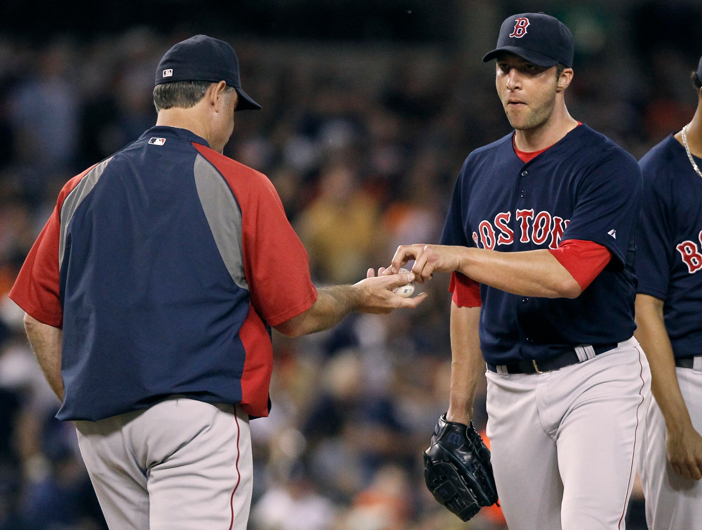 DETROIT, MI - JUNE 6: Pitcher Chris Capuano #55 of the Boston Red Sox is pulled by manager John Farrell of the Boston Red Sox after giving a home run and a triple to the only two batter he faced during the eighth inning at Comerica Park on June 6, 2014 in Detroit, Michigan. The Tigers defeated the Red Sox 6-2. (Photo by Duane Burleson/Getty Images)
