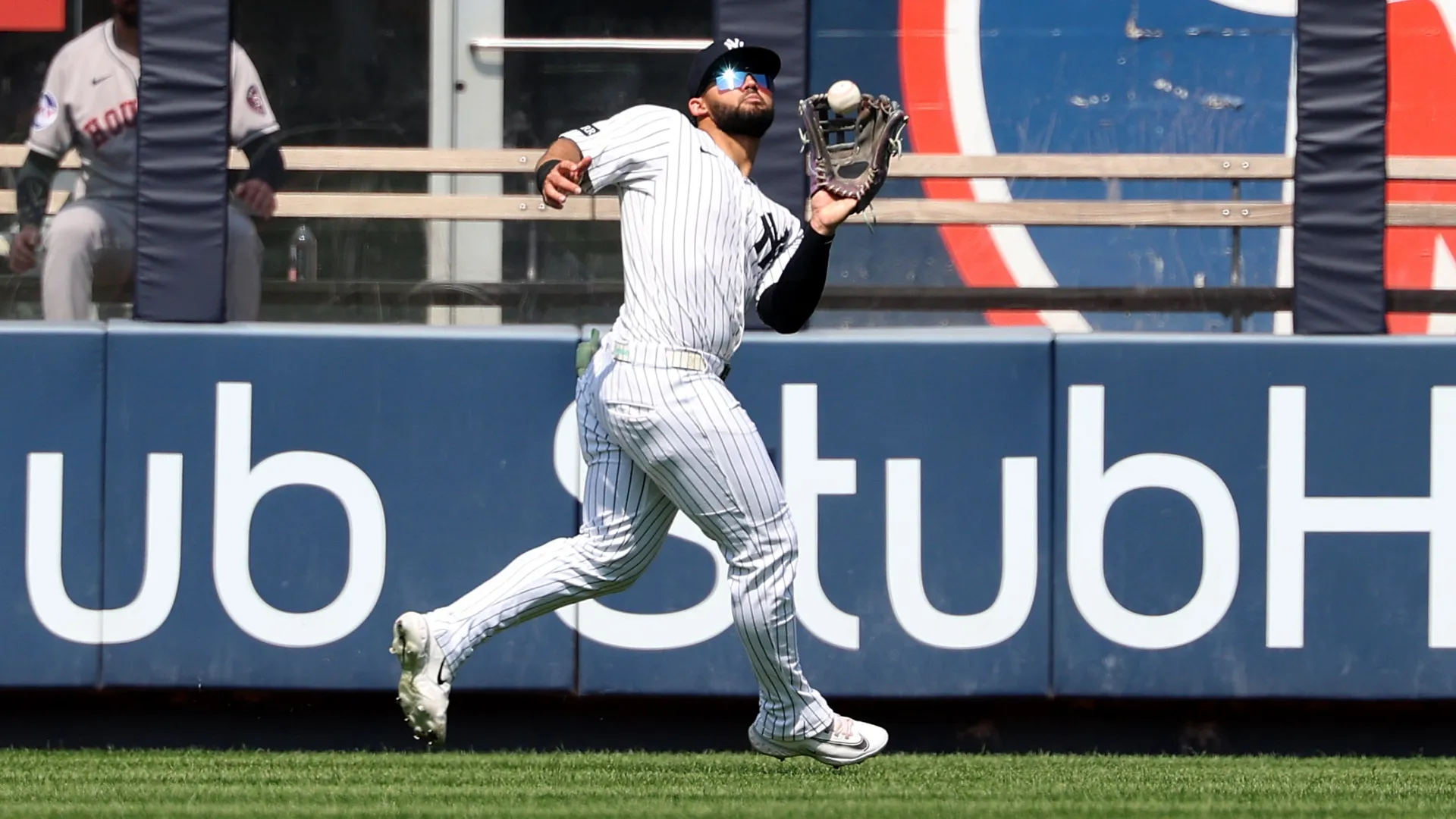 Jasson Domínguez #24 of the Yankees makes a catch against the Astros. Al Bello/Getty Images