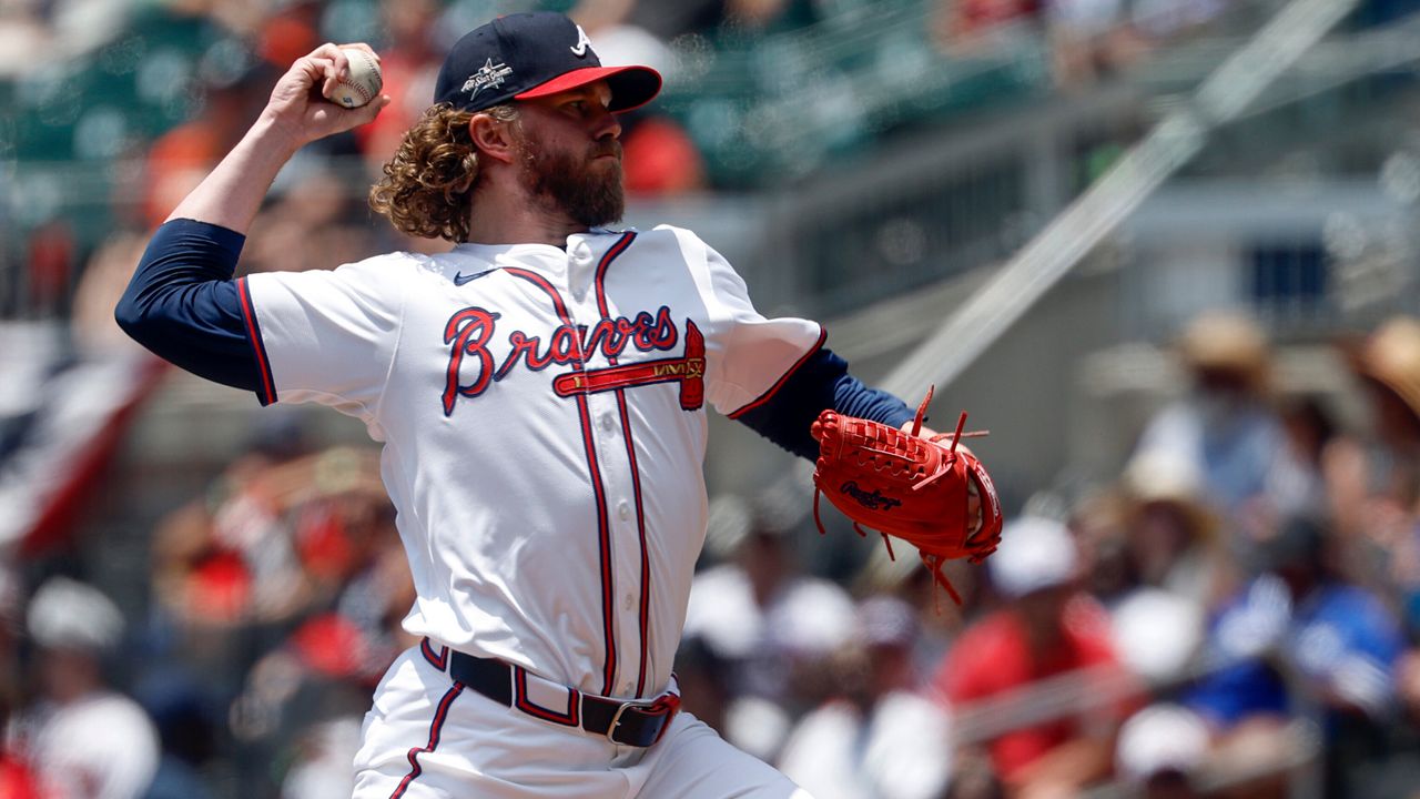 Former Atlanta Braves pitcher Pierce Johnson throws during the eighth inning of a baseball game against the Baltimore Orioles, July 6, 2025, in Atlanta. (AP Photo/Butch Dill, File)