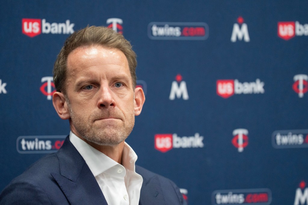 Tom Pohlad speaking at a baseball news conference.