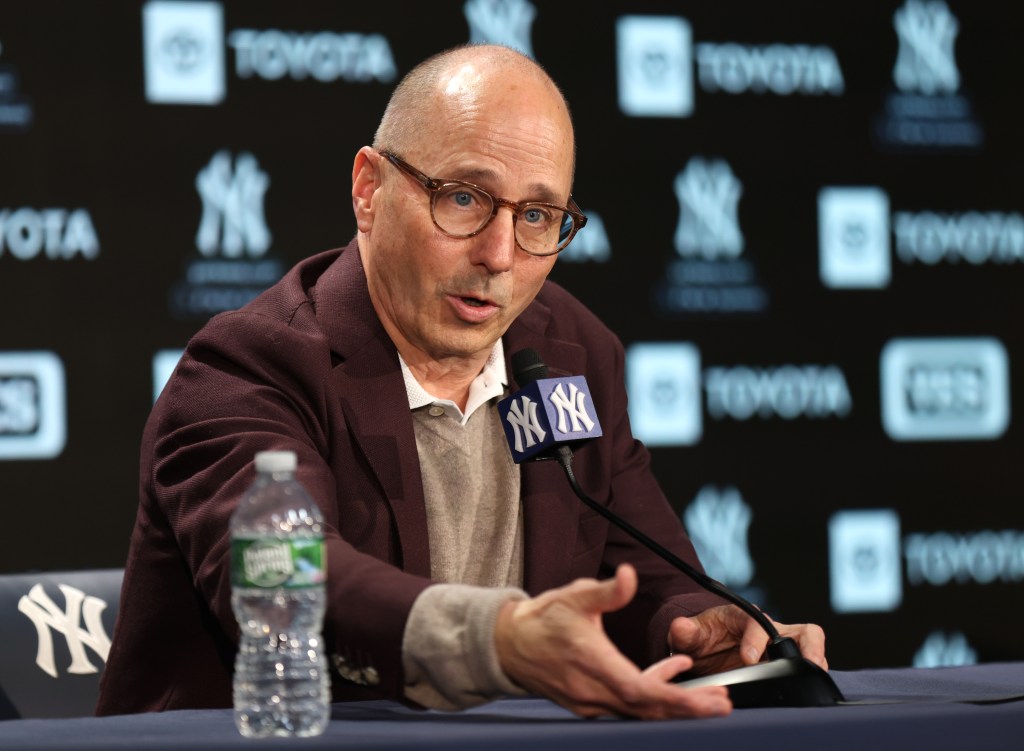 New York Yankees GM Brian Cashman speaking at a press conference at Yankee Stadium.
