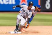 An image collage containing 1 images, Image 1 shows Cody Bellinger of the New York Yankees sliding into second base during a baseball game