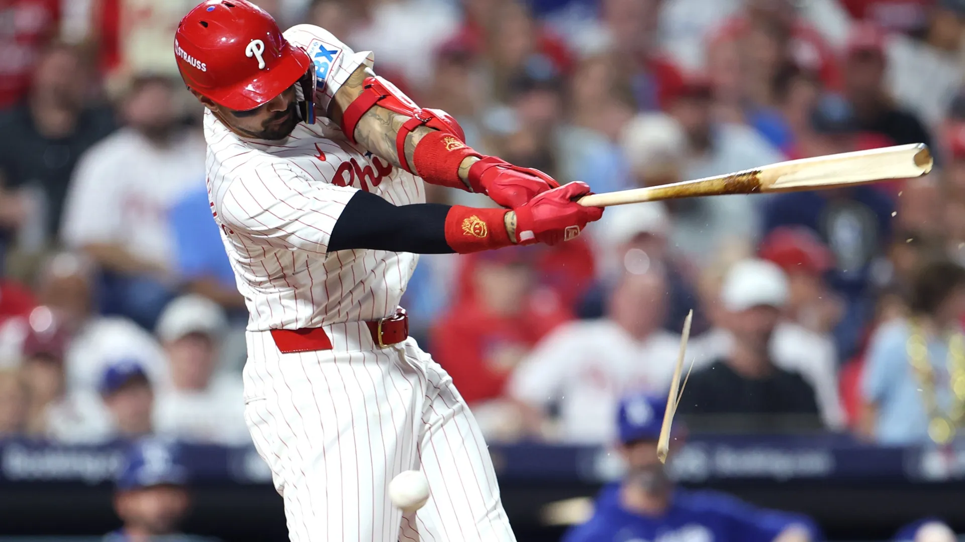 Nick Castellanos #8 of the Phillies breaks his bat. Emilee Chinn/Getty Images