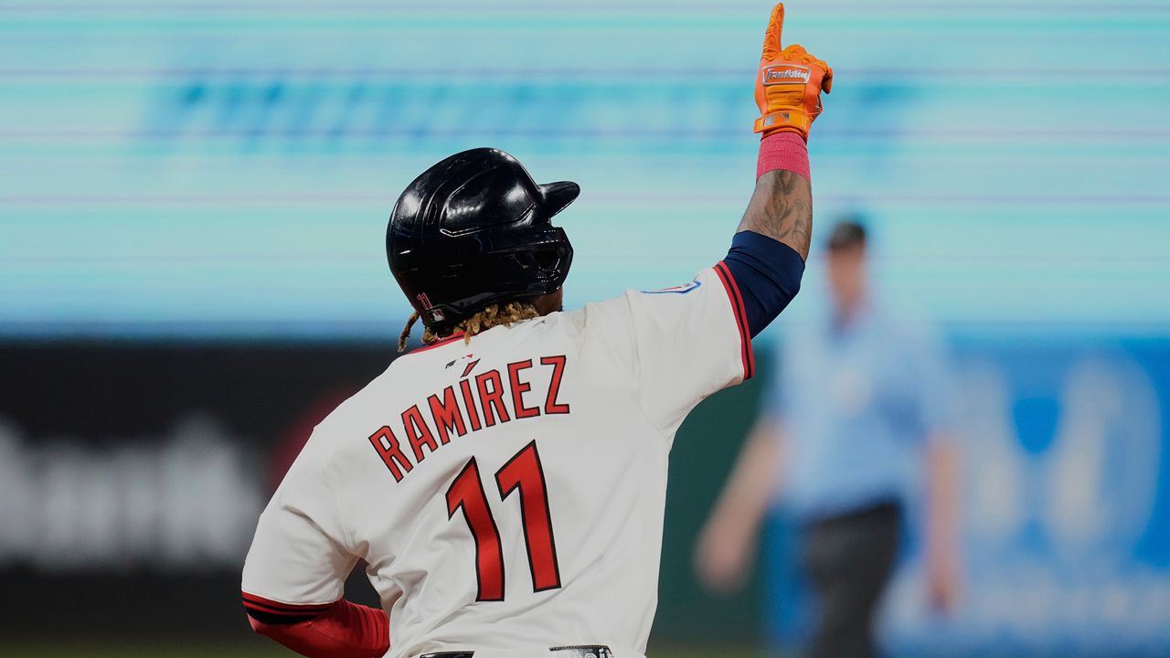 Cleveland Guardians' Jose Ramirez gestures as he runs the bases with a home run in the eighth inning of a baseball game against the Miami Marlins in Cleveland, Tuesday, Aug. 12, 2025.