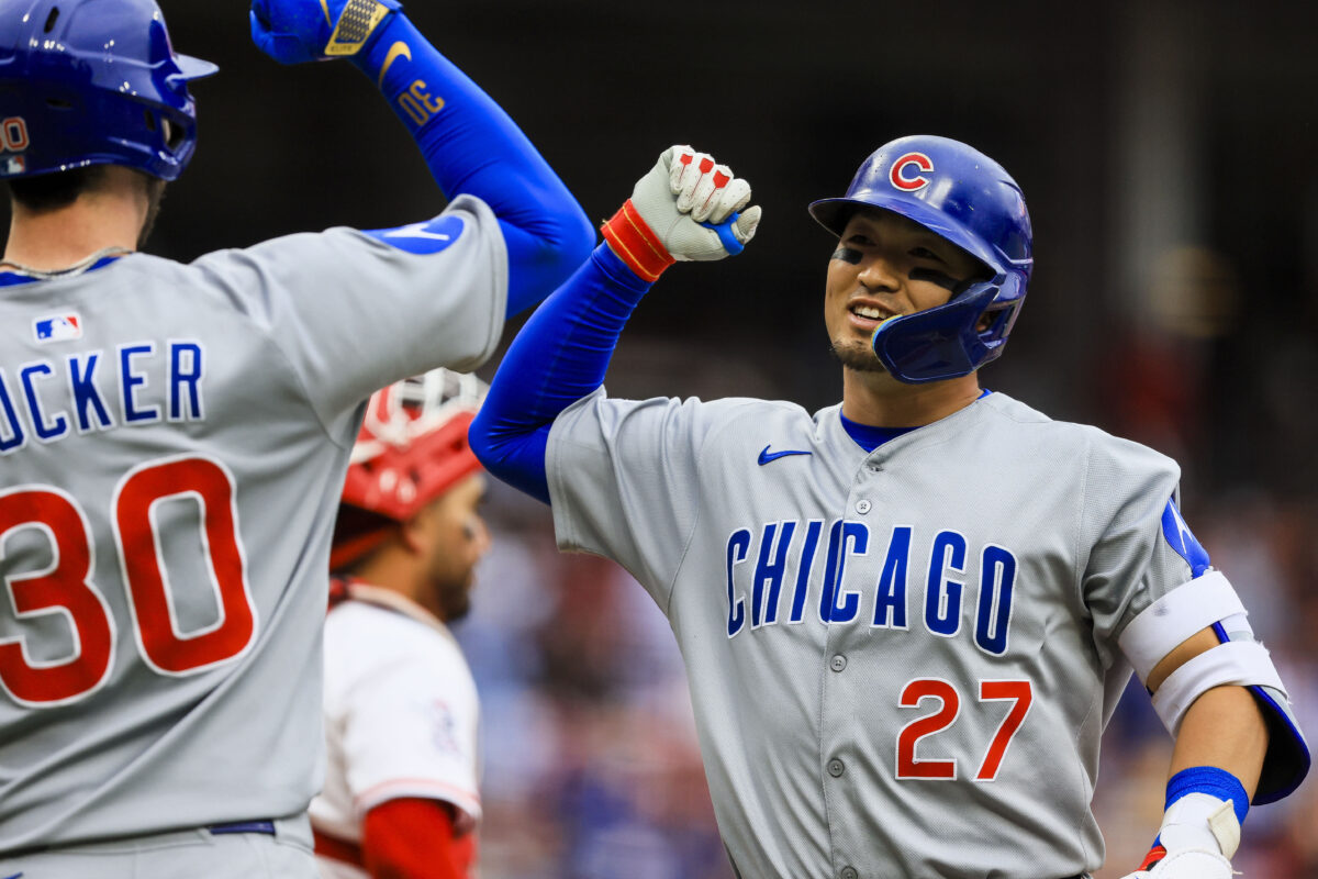 May 25, 2025; Cincinnati, Ohio, USA; Chicago Cubs designated hitter Seiya Suzuki (27) reacts with outfielder Kyle Tucker (30) after hitting a three-run home run in the eighth inning against the Cincinnati Reds at Great American Ball Park. Mandatory Credit: Katie Stratman-Imagn Images