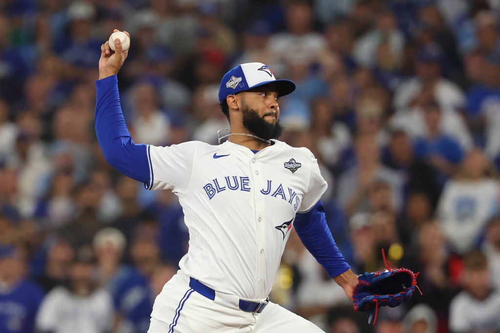 Toronto Blue Jays pitcher Seranthony Domínguez mid-pitch during Game 7 of the World Series.
