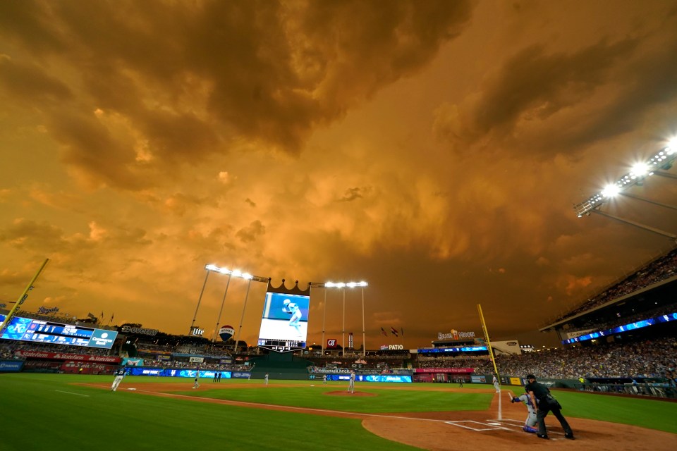 Storm clouds roll over Kauffman Stadium during a game between the New York Mets and Kansas City Royals on July 11, 2025