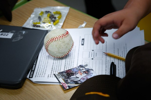 A few of the students from Smythe Elementary School were lucky enough to have an autographed baseball card of Padres player Fernando Tatis Jr. (Nelvin C. Cepeda / The San Diego Union-Tribune)