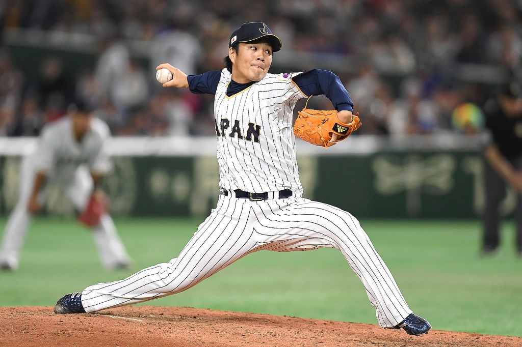 Takahiro Norimoto of Japan pitches during the World Baseball Classic.