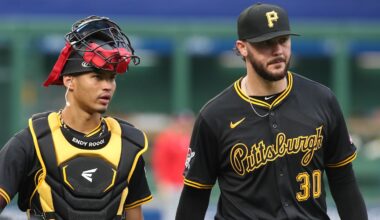Apr 14, 2025; Pittsburgh, Pennsylvania, USA;  Pittsburgh Pirates catcher Endy Rodriguez (5) and starting pitcher Paul Skenes (30) make their way in from the bullpen to play the Washington Nationals at PNC Park. Mandatory Credit: Charles LeClaire-Imagn Images