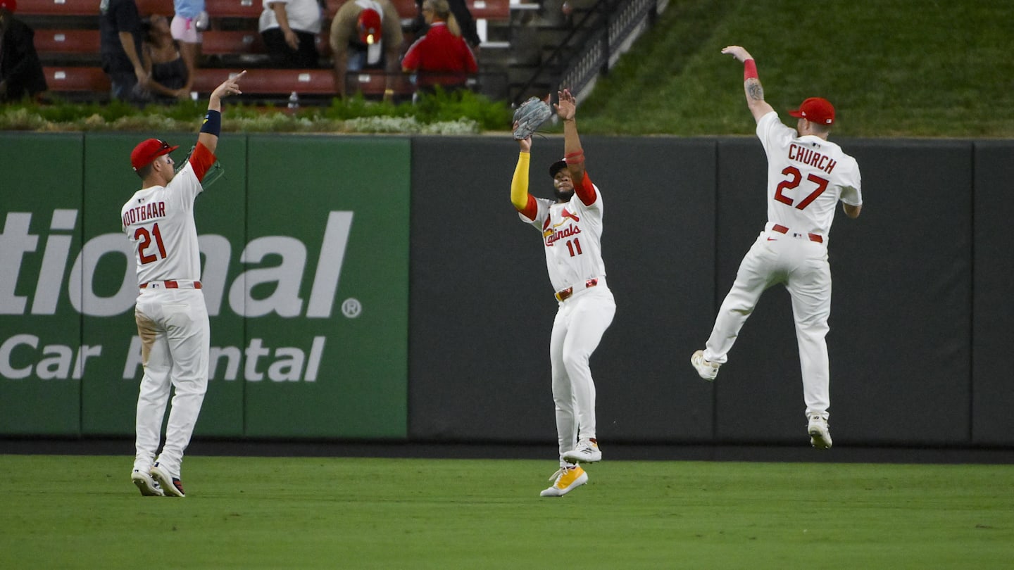 Sep 2, 2025; St. Louis, Missouri, USA;  St. Louis Cardinals outfielder Lars Nootbaar (21) center fielder Victor Scott II (11) and right fielder Nathan Church (27) celebrate after the Cardinals defeated the Athletics at Busch Stadium. Mandatory Credit: Jeff Curry-Imagn Images
