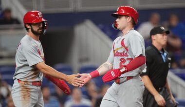Aug 19, 2025; Miami, Florida, USA;  St. Louis Cardinals second baseman Thomas Saggese (25) congratulates center fielder Nathan Church (27) on scoring a run in the second inning against the Miami Marlins at loanDepot Park. Mandatory Credit: Jim Rassol-Imagn Images