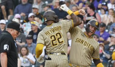 May 10, 2025; Denver, Colorado, USA; San Diego Padres outfielder Jason Heyward (22) is congratulated by first baseman Gavin Sheets (30) after his home run during the fourth inning against the Colorado Rockies  at Coors Field. Mandatory Credit: John Leyba-Imagn Images