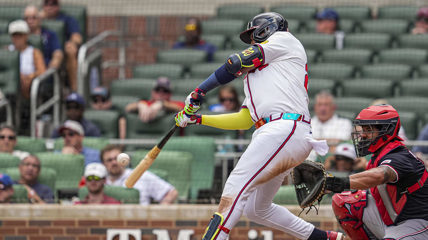 Sep 24, 2025; Cumberland, Georgia, USA; Atlanta Braves designated hitter Marcell Ozuna (20) hits a home run against the Washington Nationals during the eighth inning at Truist Park. Mandatory Credit: Dale Zanine-Imagn Images
