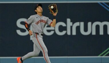 Sep 20, 2025; Los Angeles, California, USA;  San Francisco Giants center fielder Jung Hoo Lee (51) makes an out in the eighth inning against the Los Angeles Dodgers at Dodger Stadium. Mandatory Credit: Jayne Kamin-Oncea-Imagn Images
