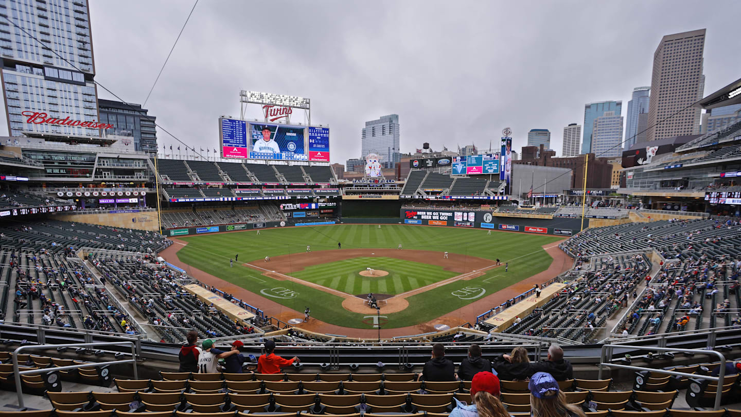 Jun 26, 2025; Minneapolis, Minnesota, USA; Sparsely seated fans watch the Seattle Mariners play the Minnesota Twins in the seventh inning after a nearly four and a half hour rain delay at Target Field. Mandatory Credit: Bruce Kluckhohn-Imagn Images