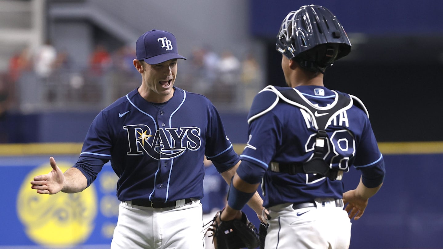 Sep 22, 2021; St. Petersburg, Florida, USA; Tampa Bay Rays relief pitcher David Robertson (30) and Tampa Bay Rays catcher Francisco Mejia (28) celebrate as they beat the Toronto Blue Jays to clinch a playoff spot at Tropicana Field. Mandatory Credit: Kim Klement-Imagn Images