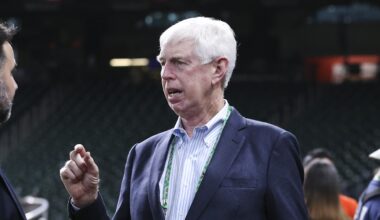 Oct 25, 2021; Houston, Texas, USA;  Atlanta Braves chairman Terry McGuirk (right) talks with general manager Alex Anthopoulos (left) during workouts before Game 1 of the World Series between the Houston Astros and the Atlanta Braves at Minute Maid Park. Mandatory Credit: Troy Taormina-Imagn Images