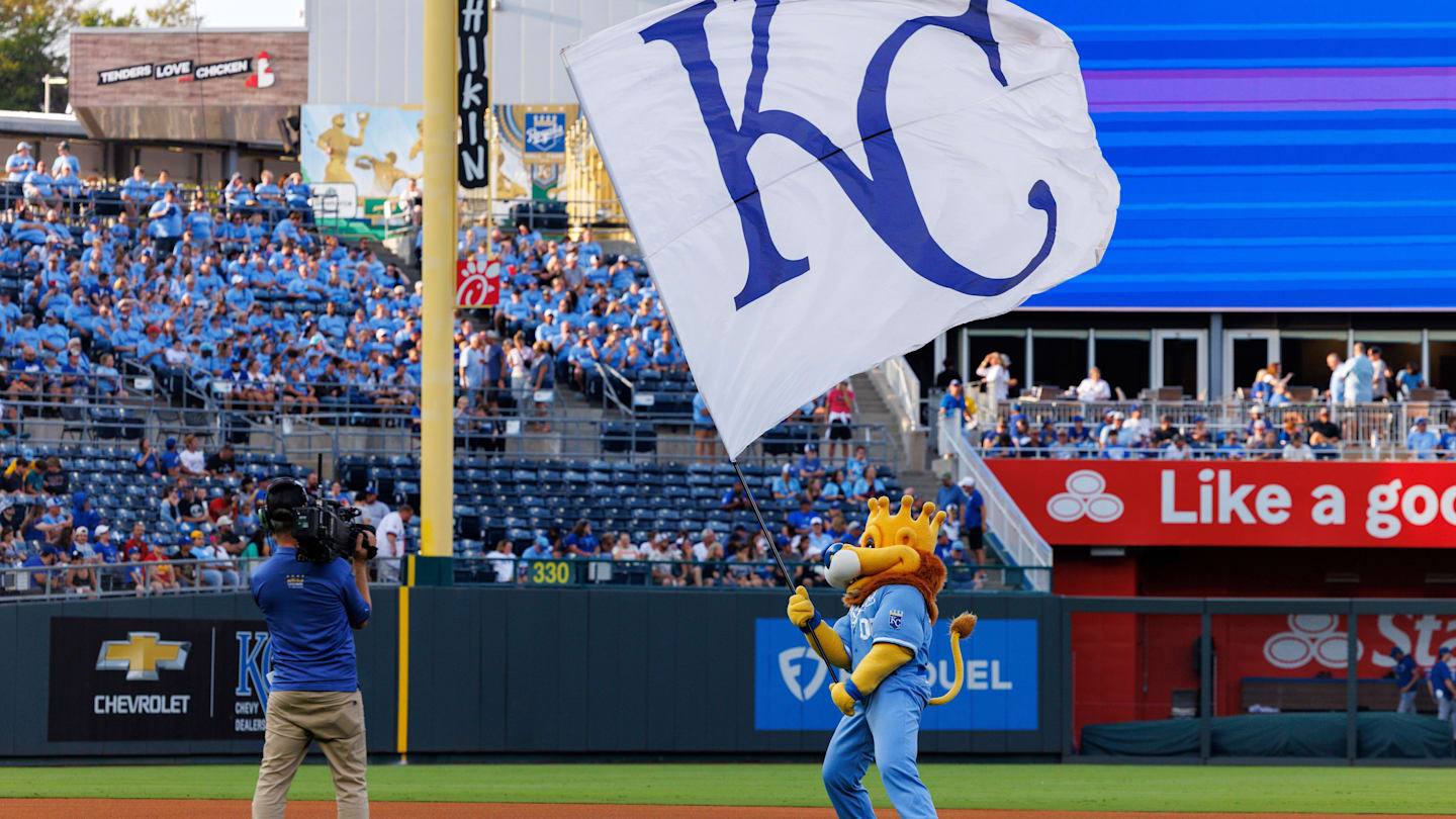 Sep 20, 2025; Kansas City, Missouri, USA; Kansas City Royals mascot Slugger waves the KC flag prior to the game against the Toronto Blue Jays at Kauffman Stadium. Mandatory Credit: William Purnell-Imagn Images