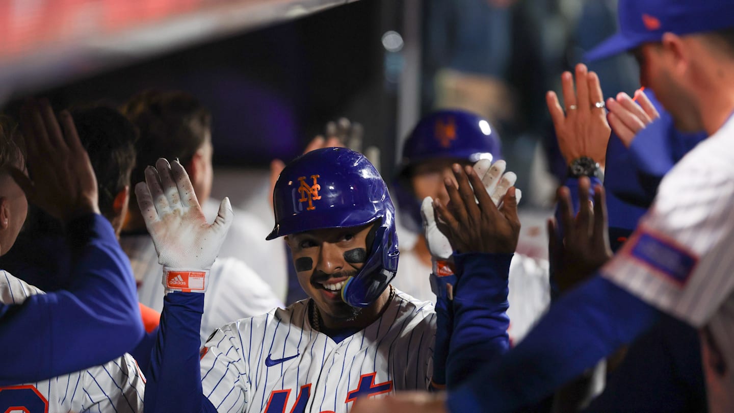 Aug 27, 2025; New York City, New York, USA; New York Mets third baseman Mark Vientos (27) celebrates with teammates after hitting a two run home run during the seventh inning against the Philadelphia Phillies at Citi Field. Mandatory Credit: Vincent Carchietta-Imagn Images