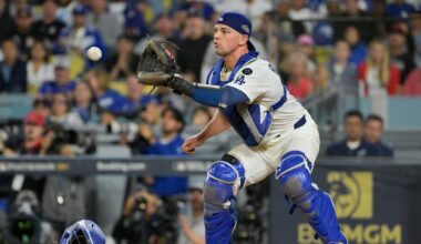 Oct 1, 2025; Los Angeles, California, USA; Los Angeles Dodgers catcher Ben Rortvedt (47) fields a throw to make an out at home plate against the Cincinnati Reds in the sixth inning during game two of the Wildcard round for the 2025 MLB playoffs at Dodger Stadium. Mandatory Credit: Jayne Kamin-Oncea-Imagn Images