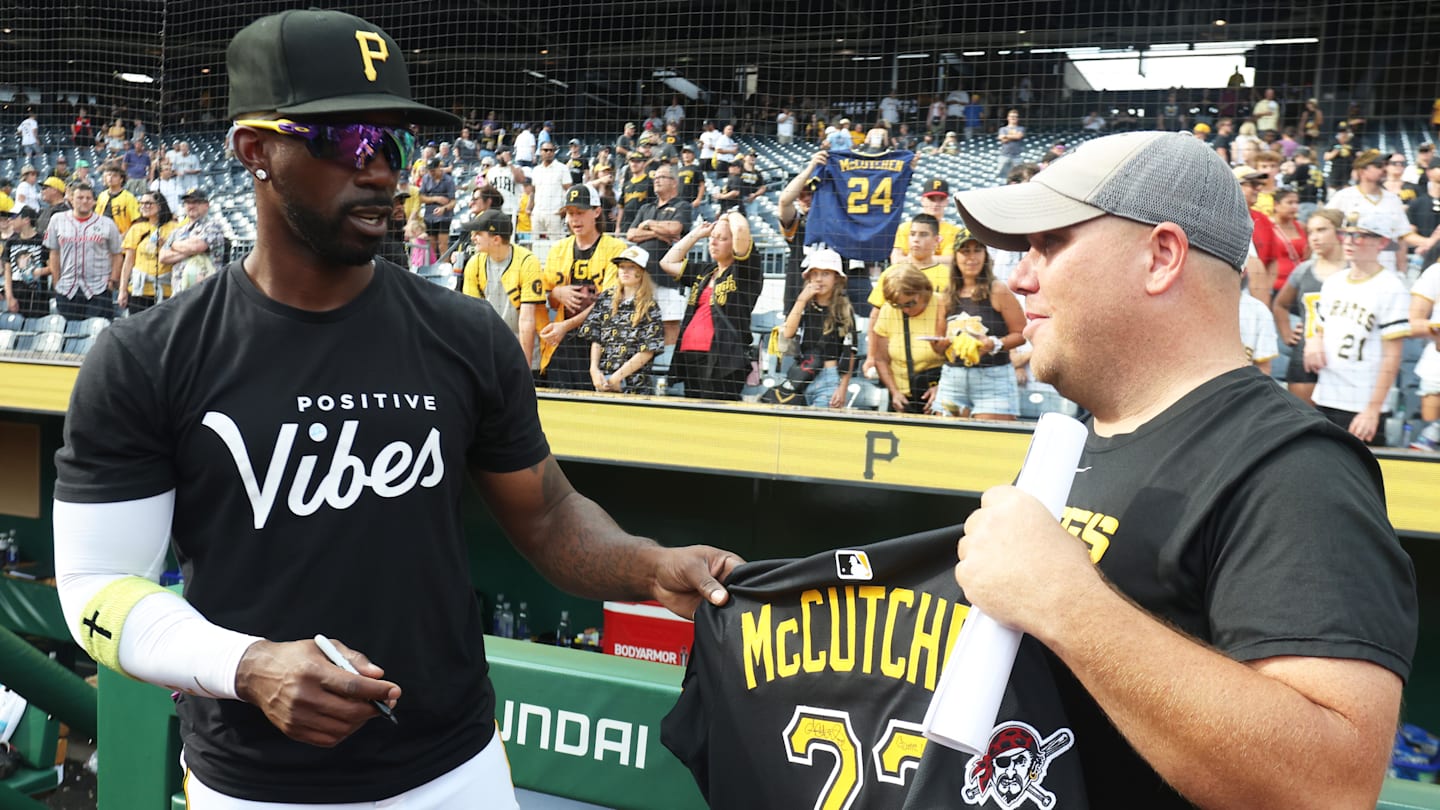 Pittsburgh Pirates designated hitter Andrew McCutchen gives away his game jersey.